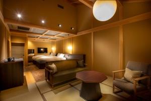 Postel nebo postele na pokoji v ubytování Hotel Utano Kyoto Besho