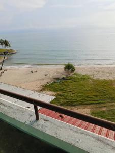 a view of the beach from a balcony at ZNZ Oasis Homestay in Port Dickson