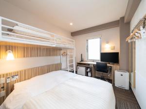 Postel nebo postele na pokoji v ubytování Super Hotel Kochi