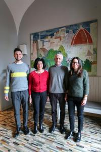 three people posing for a picture in a room at Hotel Il Sole in Empoli