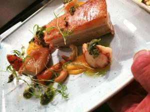 a white plate with a piece of food on it at The Treebridge Hotel in Nunthorpe