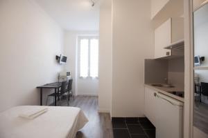Kuchyň nebo kuchyňský kout v ubytování Appartements Foch