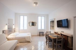 Postel nebo postele na pokoji v ubytování Appartements Foch