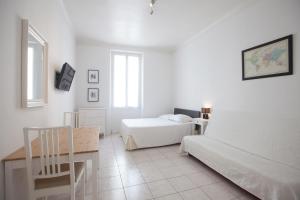 Postel nebo postele na pokoji v ubytování Appartements Foch