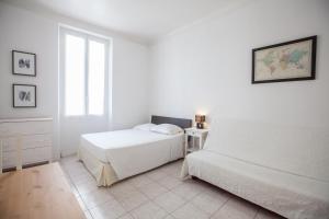 Postel nebo postele na pokoji v ubytování Appartements Foch