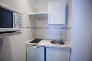 Kuchyň nebo kuchyňský kout v ubytování Appartements Foch + 23 fotografií