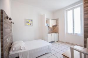 Postel nebo postele na pokoji v ubytování Appartements Foch