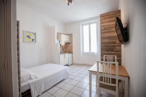 Postel nebo postele na pokoji v ubytování Appartements Foch