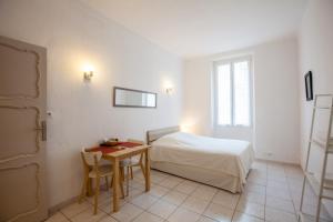 Postel nebo postele na pokoji v ubytování Appartements Foch