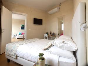 Letto o letti in una camera di GozoWindmill Apartments