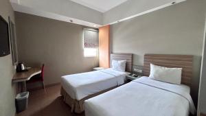 Voodi või voodid majutusasutuse Metland Hotel Bekasi toas