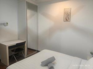 a bedroom with a bed and a desk and a mirror at 018-6 Sweet Home-Casa Residency 2R 2B in Kuala Lumpur +15 photos