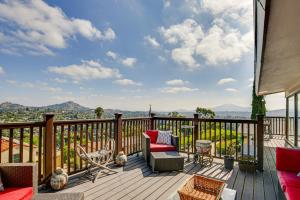 a deck with a couch and chairs on a balcony at Mt Nebo Oasis in La Mesa with Wraparound Deck in La Mesa