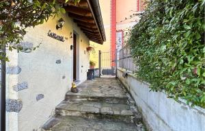 an alley way with a building and a door at Casetta Dei Lupi in Miazzina +18 photos
