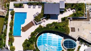 an overhead view of a house with a swimming pool at Serenity at Solaris 101 in Forster