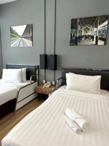 Postel nebo postele na pokoji v ubytování The Terminal Khon Kaen Hotel