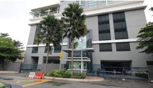 a white building with palm trees in front of it at 018-6 Sweet Home-Casa Residency 2R 2B in Kuala Lumpur