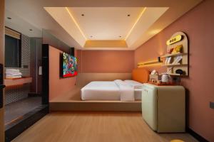 Postelja oz. postelje v sobi nastanitve Super Time Trendy Design Hotel Guangzhou Beijing Road Pedestrian Street Dafo Temple Branch