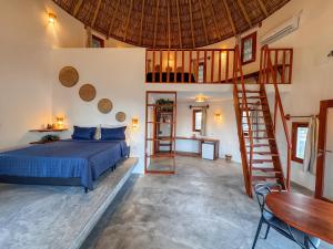 Postel nebo postele na pokoji v ubytování VentoVinte Beach Club + 36 fotografií