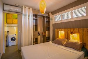 Postel nebo postele na pokoji v ubytování Appartement Naïa, avec piscine commune