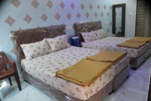 Postel nebo postele na pokoji v ubytování Atithi home stay