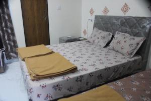 Postel nebo postele na pokoji v ubytování Atithi home stay