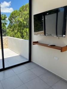 Μια τηλεόραση ή/και κέντρο ψυχαγωγίας στο Casa Itzae Hotel Boutique