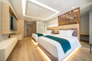Postel nebo postele na pokoji v ubytování Mehood EZZI Hotel Xi'an Jinye Yi Road Zhangba Si Road