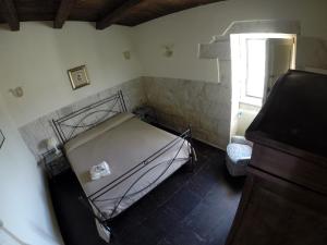 A bed or beds in a room at Antico Frantoio Penna