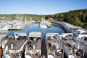a bunch of boats docked in a marina at Sea Diva - luxury boathouse in Portorož