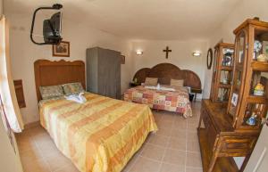 Postel nebo postele na pokoji v ubytování Hotel Hacienda Xico Inn