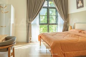 a bedroom with a bed and a chair and a window at Enclave Premium Suites at Bukit Tinggi in Bukit Tinggi +148 photos