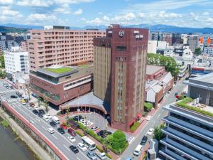 an aerial view of a city with a clock tower at Kumamoto Hotel Castle in Kumamoto