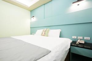 Postel nebo postele na pokoji v ubytování I Hi Loveriver Hotel