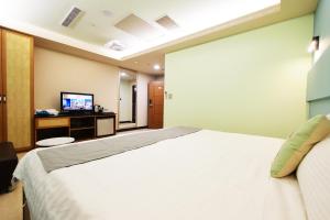 Postel nebo postele na pokoji v ubytování I Hi Loveriver Hotel