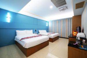 Postel nebo postele na pokoji v ubytování I Hi Loveriver Hotel