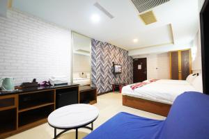 Postel nebo postele na pokoji v ubytování I Hi Loveriver Hotel