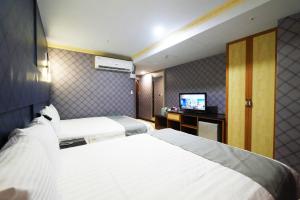Postel nebo postele na pokoji v ubytování I Hi Loveriver Hotel