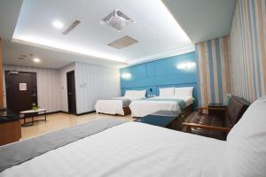 Postel nebo postele na pokoji v ubytování I Hi Loveriver Hotel
