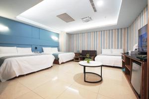Postel nebo postele na pokoji v ubytování I Hi Loveriver Hotel