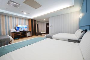 Postel nebo postele na pokoji v ubytování I Hi Loveriver Hotel