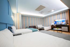 Postel nebo postele na pokoji v ubytování I Hi Loveriver Hotel