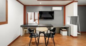 a dining room with a table and chairs at Hotel Tate V in Suwon