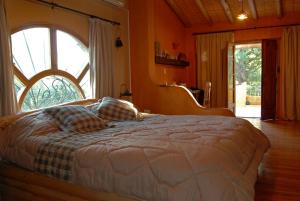 Posteľ alebo postele v izbe v ubytovaní Finca La Encantada