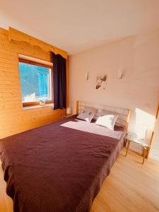 Postel nebo postele na pokoji v ubytování LE RECOIN D'EAUBONNE, charmant 2 pièces pieds des pistes 4 pers Les Balcons de Recoin