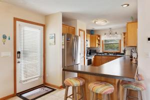 a kitchen with a counter and a refrigerator at 1714 - Destiny in Poplar Branch +32 photos