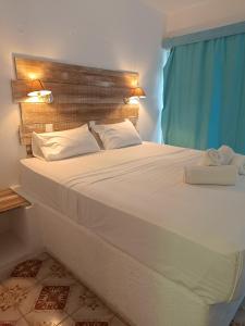 Giường trong phòng chung tại Trees Art Hotel & Suites