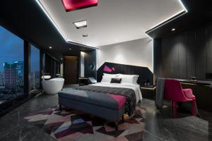 Voodi või voodid majutusasutuse Beso Designer Apartent Hotel toas