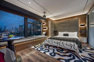Voodi või voodid majutusasutuse Beso Designer Apartent Hotel toas