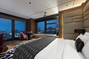 Voodi või voodid majutusasutuse Beso Designer Apartent Hotel toas